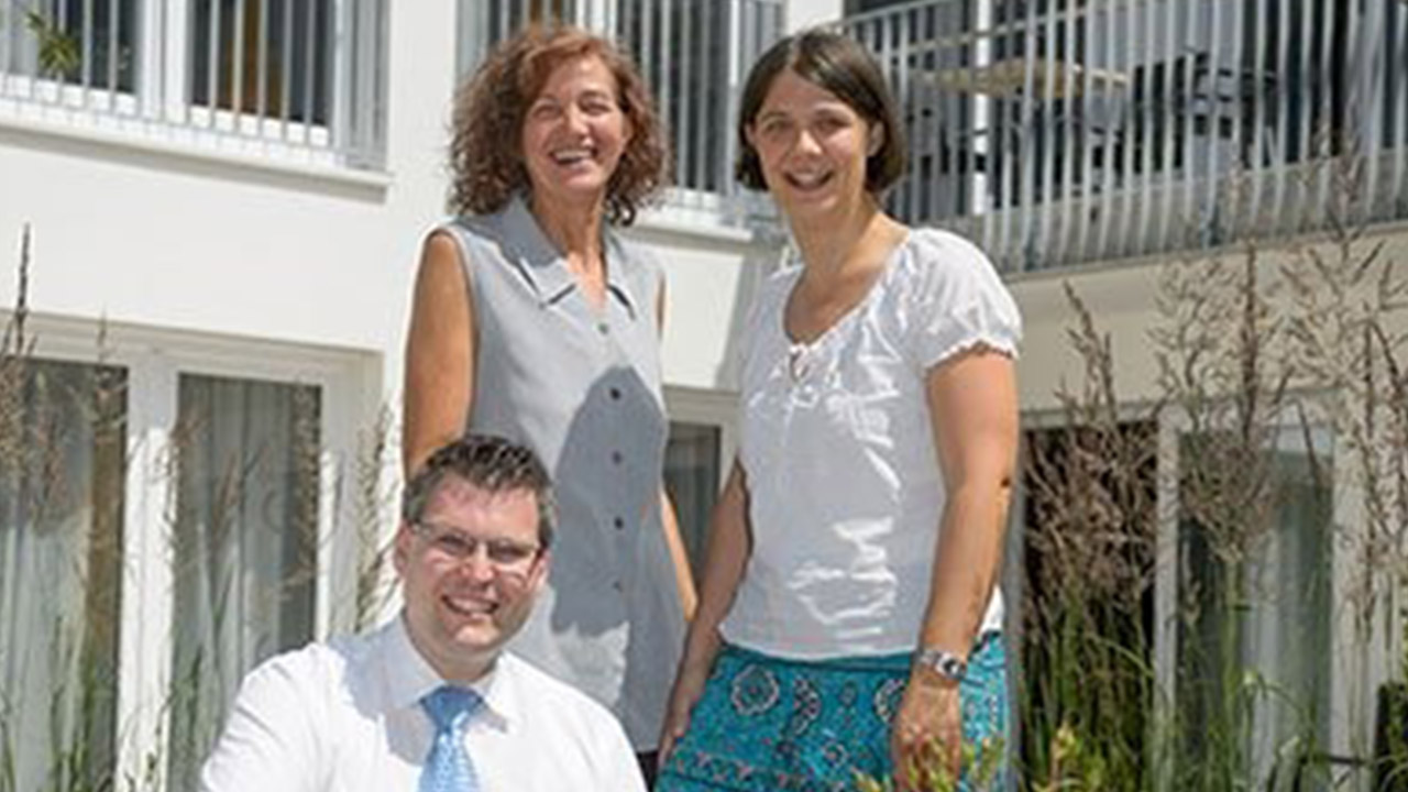 Evdiak Bild von drei Mitarbeiter:innen